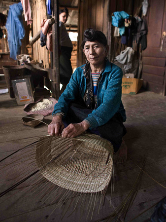 Woman weaving a basket