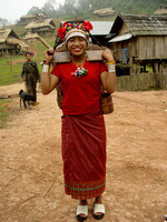 Young Akha woman on her way to collect firewood