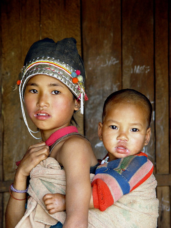 Young Akha girl with younger sibling. Ban Nammat Gao