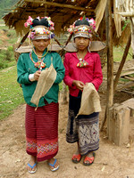 Two young akha women, on their way to the forest