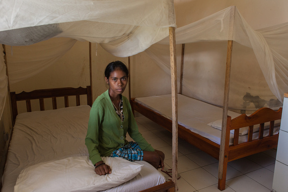 young woman in her bedroom of the TB wing