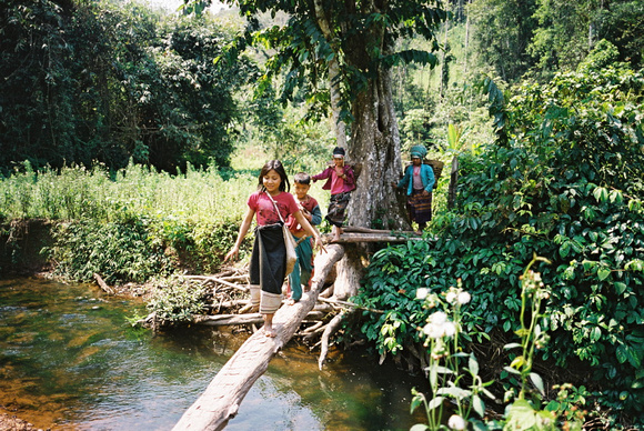 Young Akha girls crossing the river